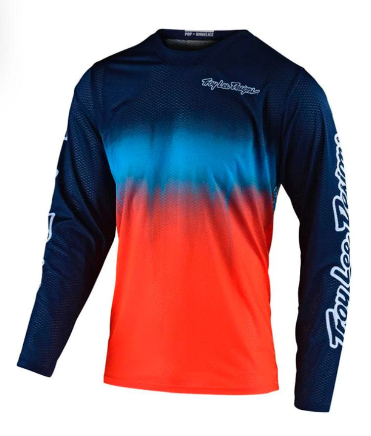 POLERA TROY LEE DESIGNS GP AIR STAIN’D NAVY / ORANGE
